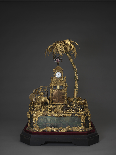 Gilt bronze clock with a country scene and water automaton