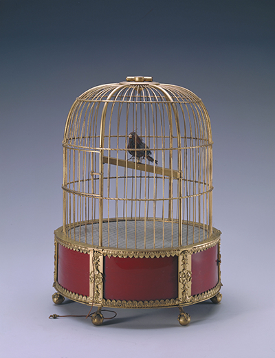 Gilt bronze clock in the form of a glass inlaid birdcage with a bird automaton